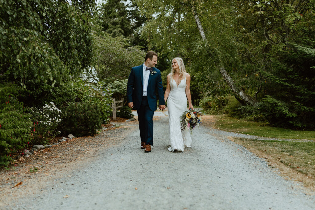 wedding dress on dirt road, walking with groom
